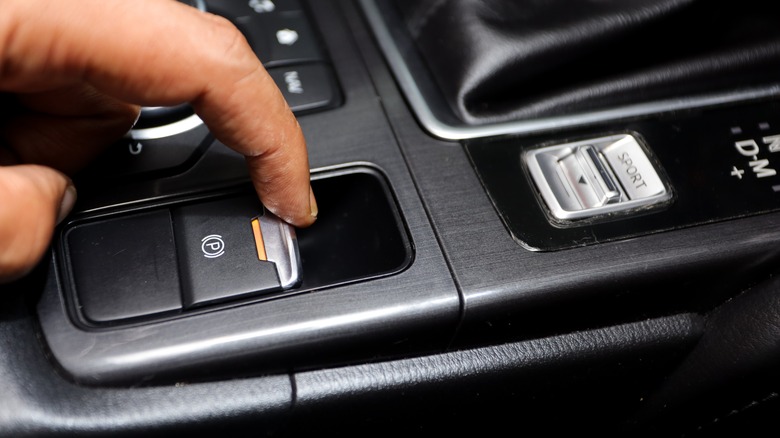 A finger activating parking brake switch