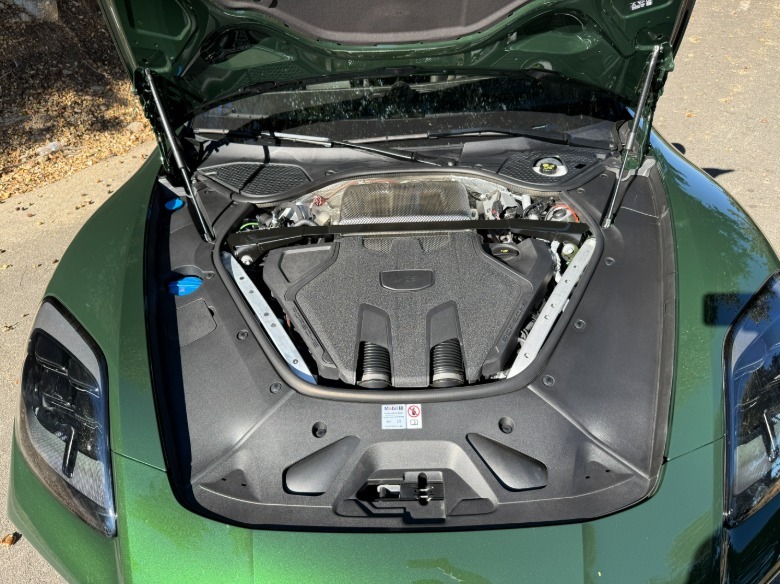 Engine bay of a green 2025 Porsche Panamera GTS