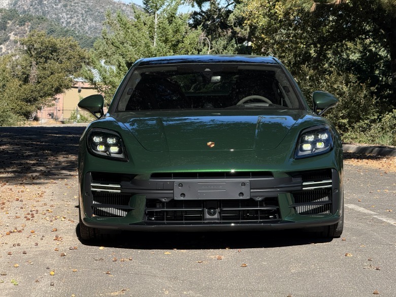 Front end of a green 2025 Porsche Panamera GTS